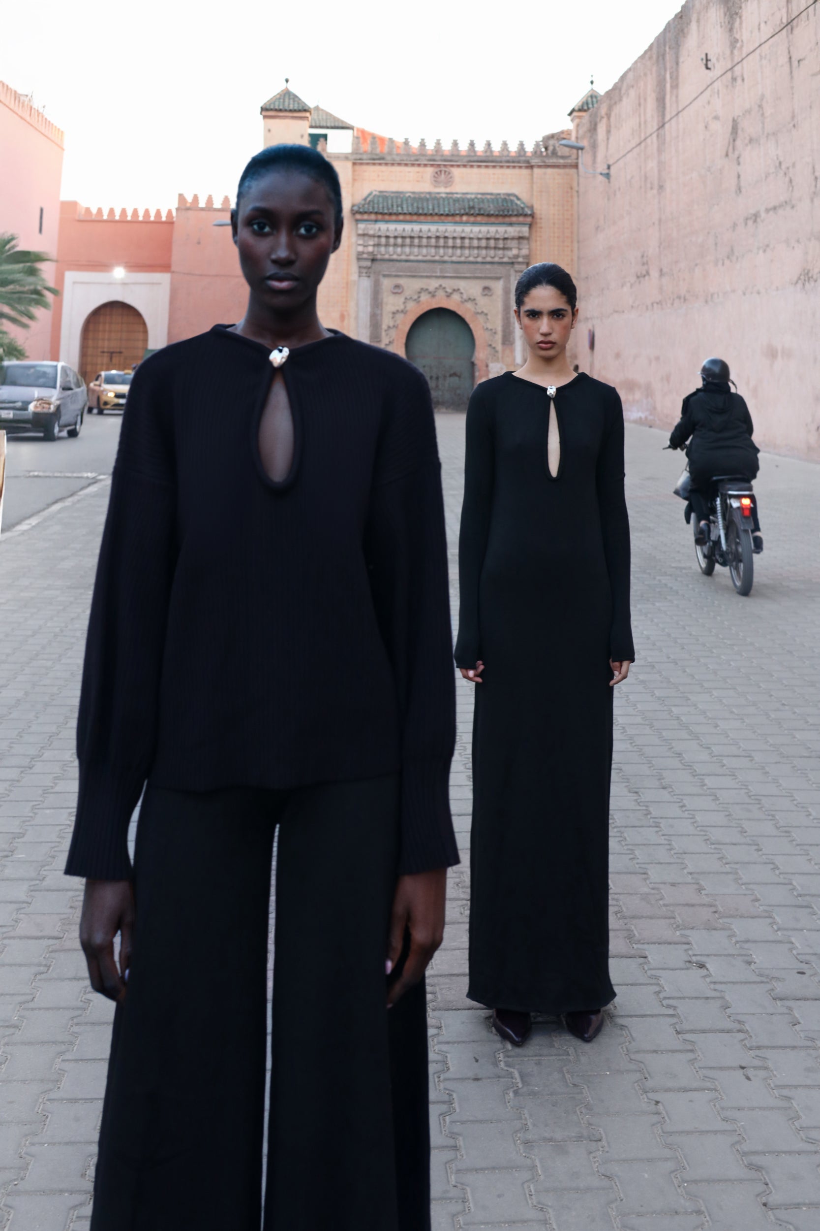 Black Ramila Dress, motion view with fluid fall and Long sleeves.