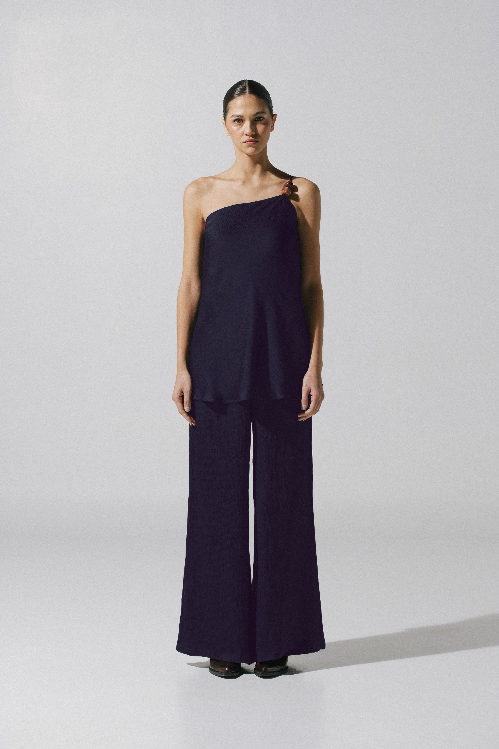 Ferrat Top by Baobab in night blue color, One-Shoulder with Embellished detail and Textured fabric.