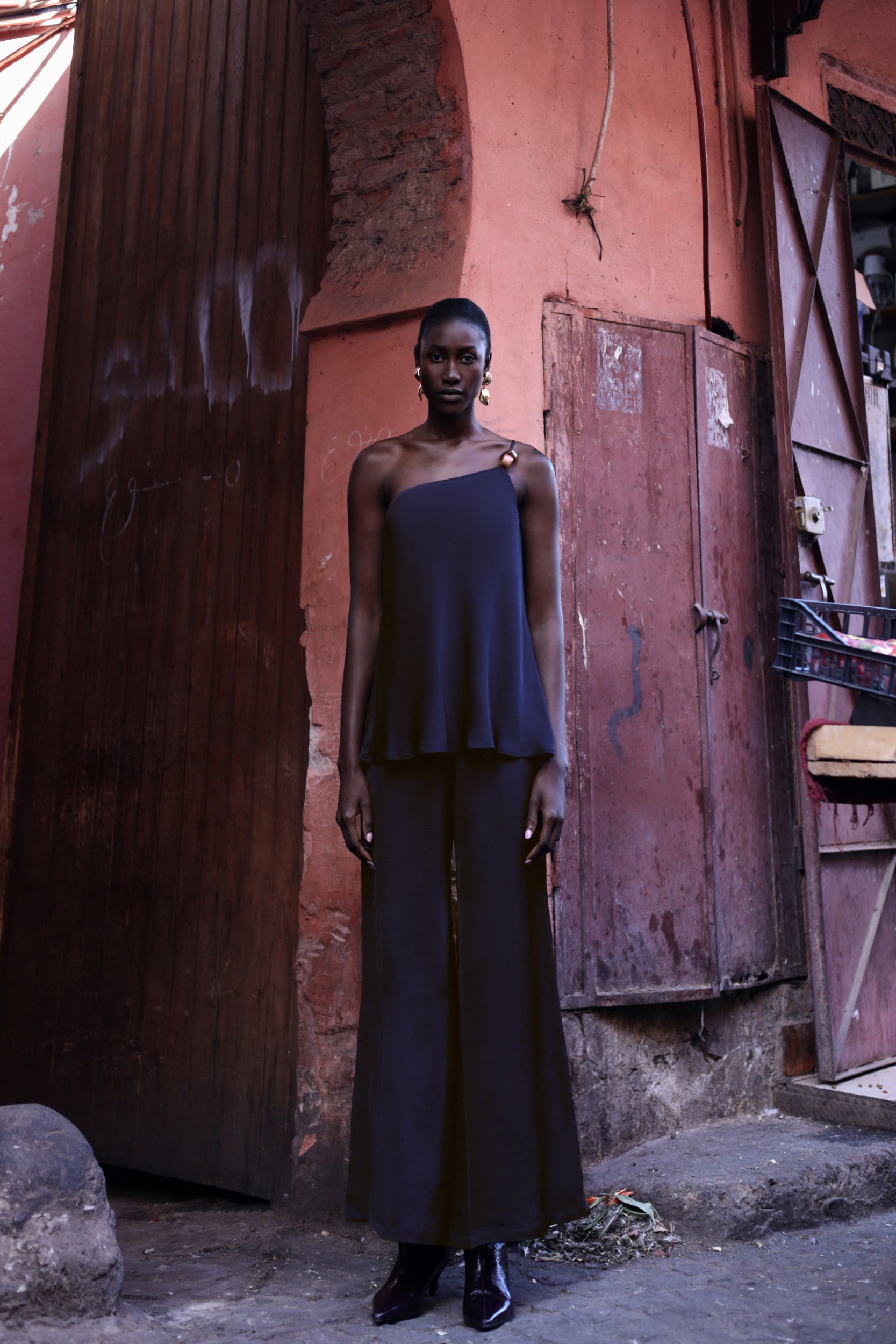 Night blue Ferrat Top paired with pants, elegant style and Textured fabric.