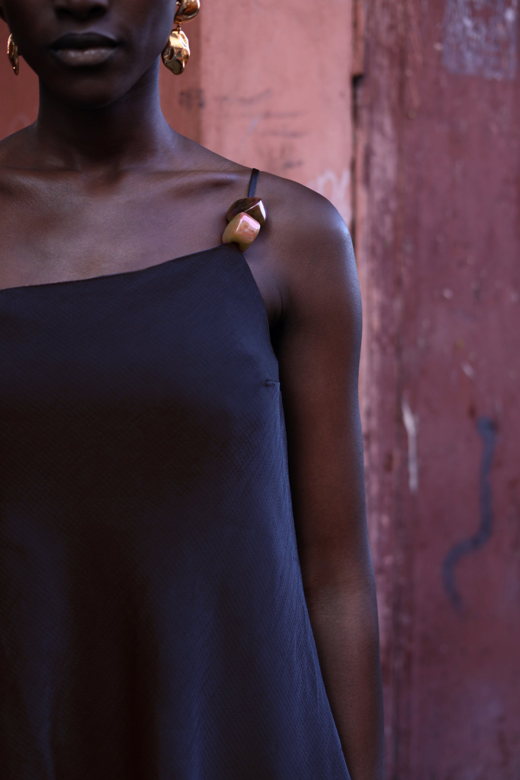 Detail of the Ferrat Top by Baobab, Embellished shoulder and Textured fabric in night blue color.
