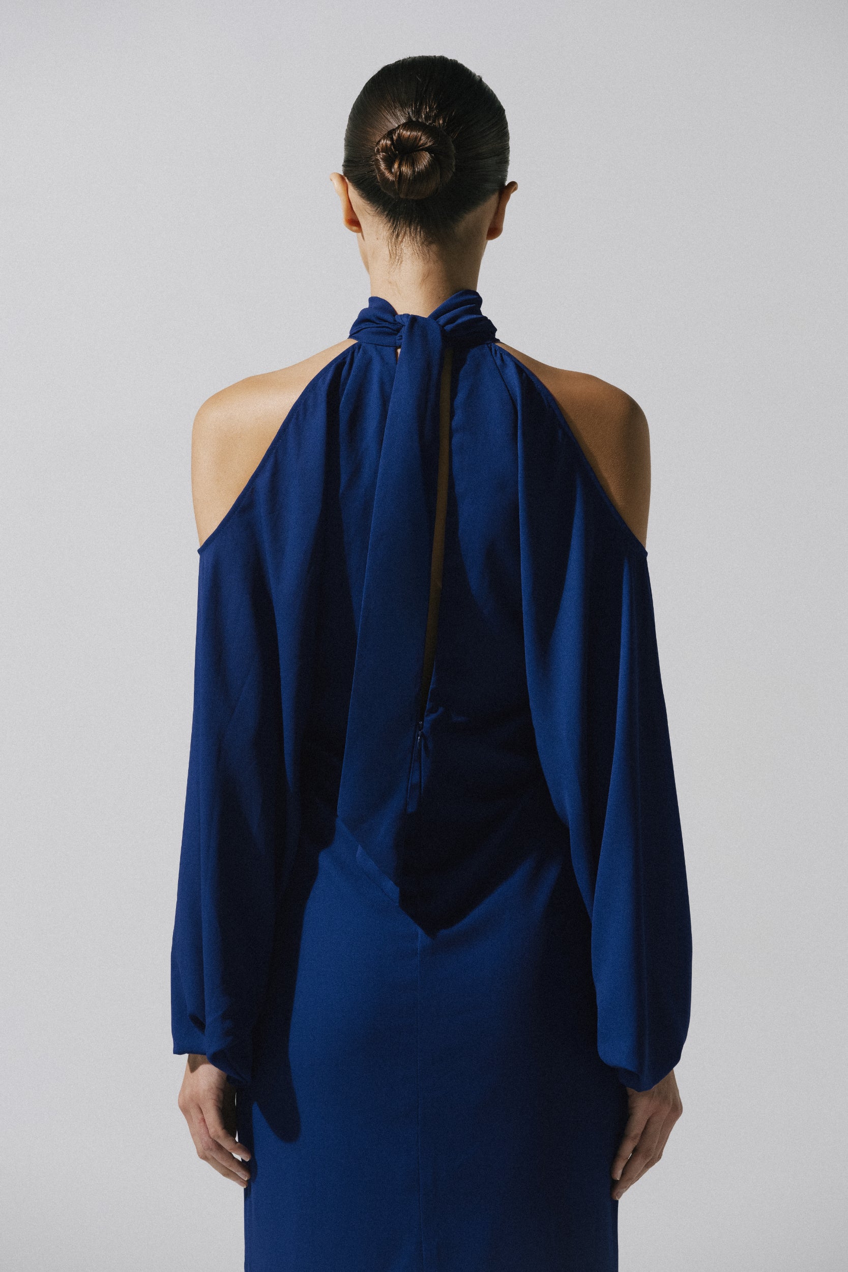 Biscay Maxi Dress by Baobab, cold shoulder and fluid fabric in deep blue tone.