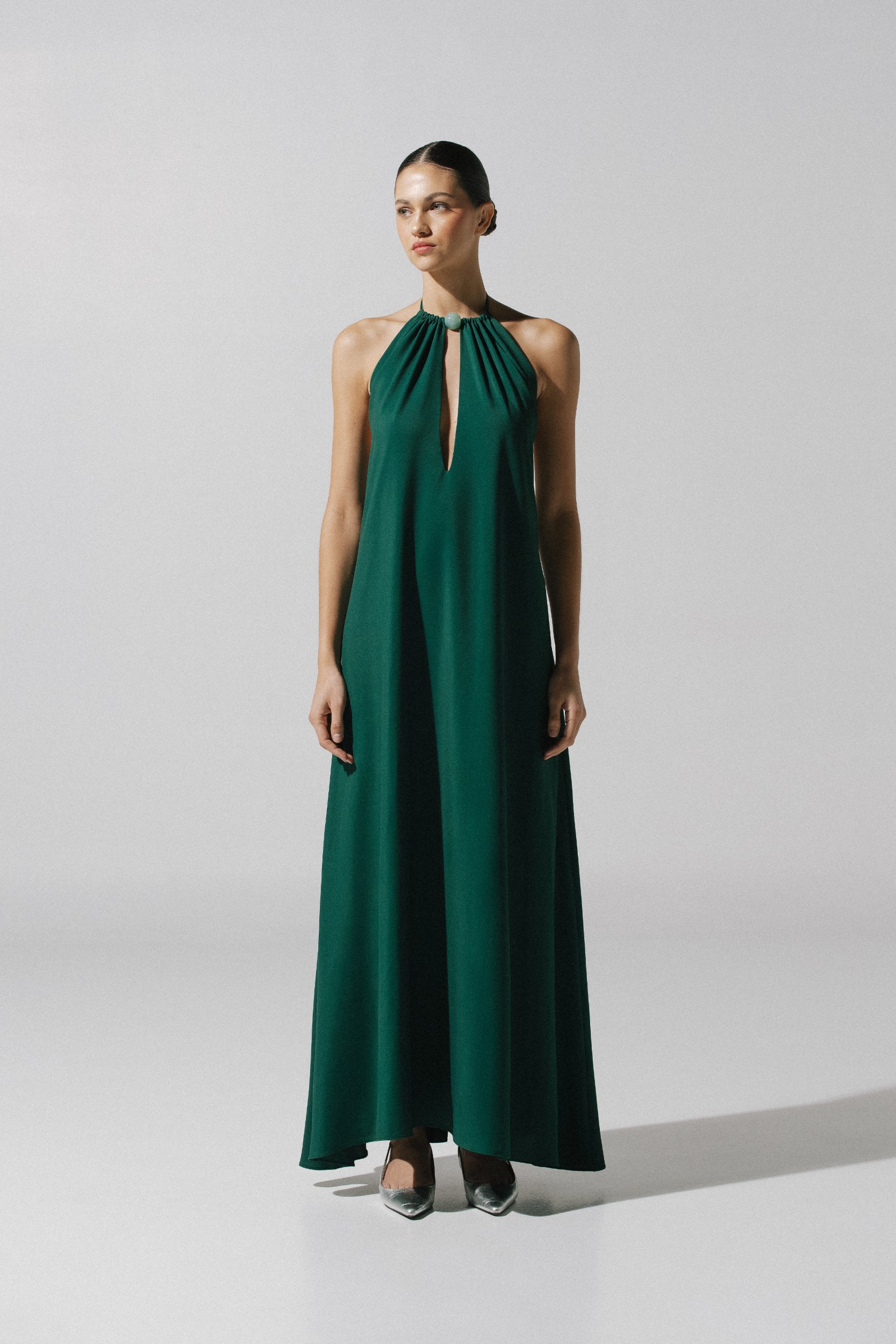 Rondine Maxi Dress by Baobab in emerald green color, Halter Neckline with Front cutouts and Embellished detail.