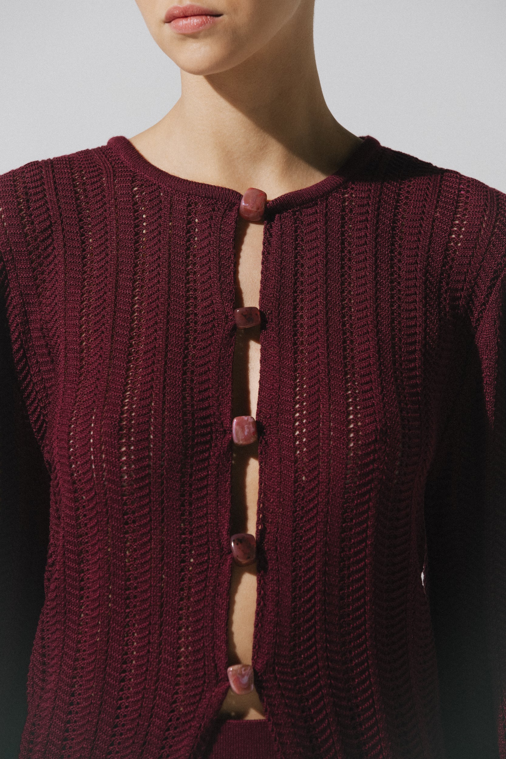 Corsica Top by Baobab in burgundy color, Round neckline with Front cutouts and Semi-sheer fabric.